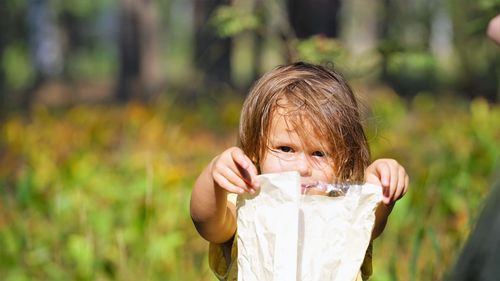 Portrait of girl holding paper bag