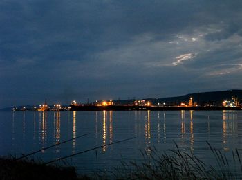 Scenic view of sea against sky at night