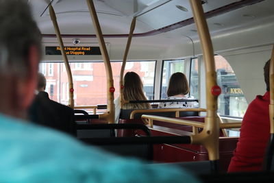 Rear view of people sitting in bus