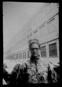 Portrait of young man standing against sky