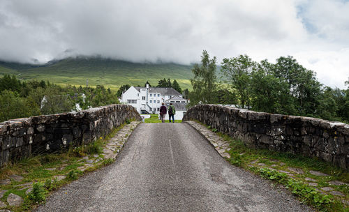 Unrecognised people walking at the bridge of orchy in the central highlands of scotland