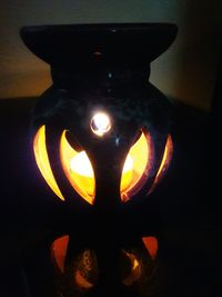 Close-up of illuminated pumpkin on table