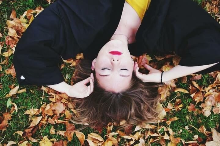 lifestyles, leisure activity, casual clothing, leaf, autumn, person, field, sitting, portrait, high angle view, dry, front view, holding, togetherness, leaves, standing, looking at camera