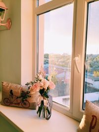 Close-up of flower vase on table at home