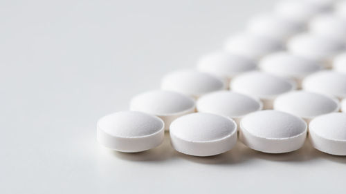 Close-up of pills against white background