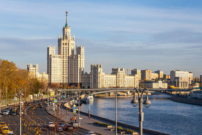 Bridge over river with buildings in background