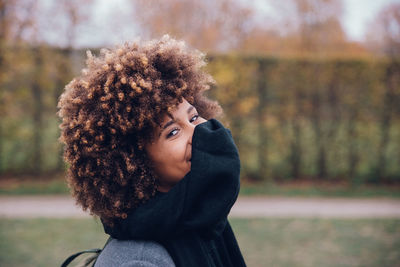 Portrait of teenage girl in park