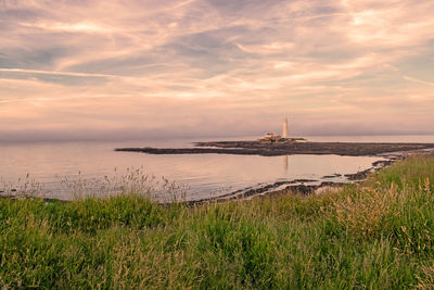 Scenic view of sea against sky during sunset