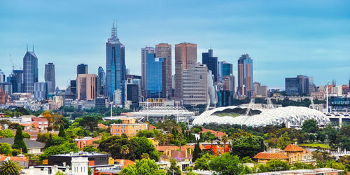 Modern buildings in city against sky