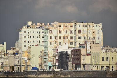 Buildings in city against sky