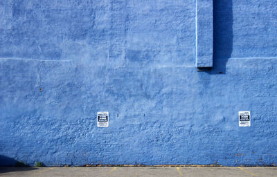 Posters on blue wall