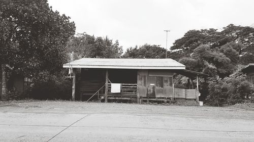 House on field against clear sky