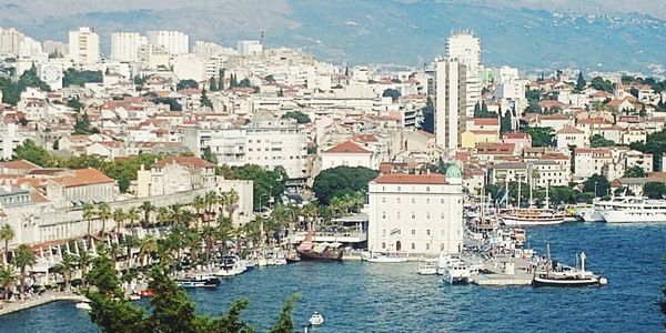 High angle view of townscape by sea