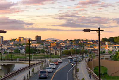 High angle view of street against sky at sunset