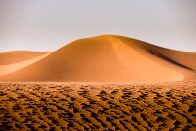 Scenic view of desert against clear sky