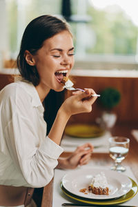 Young woman drinking glass