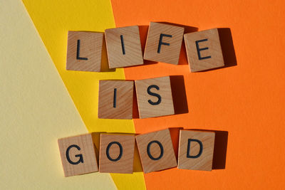 Close-up of toy blocks with text on wooden block
