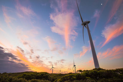 Low angle view of windmill against sky during sunset