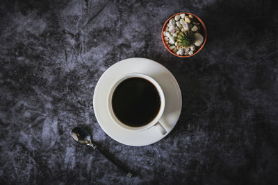 High angle view of coffee cup on table