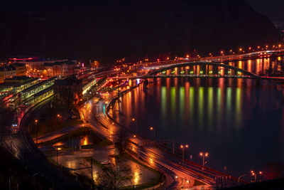 High angle view of illuminated bridge over river at night