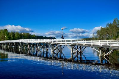 Wood bridge connecting the city to a public park on an island