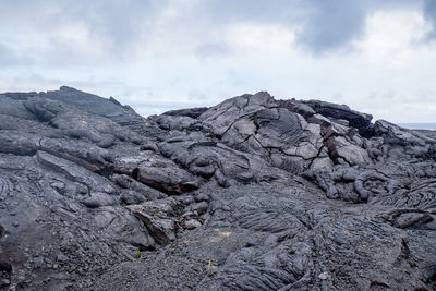 Scenic view of volcanic mountain against sky