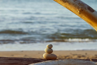 Close-up of stone stack at beach