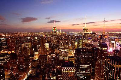 Aerial view of city lit up at night