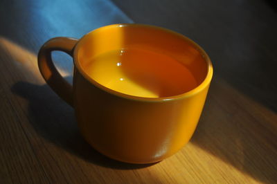 High angle view of orange tea on table