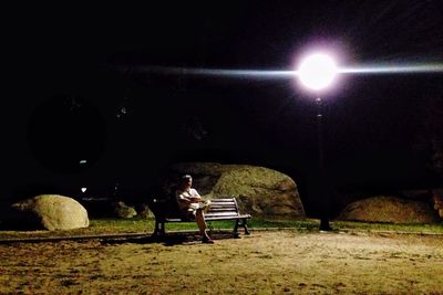 Blurred motion of woman in dark room