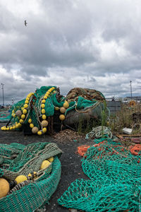 View of fishing net against cloudy sky