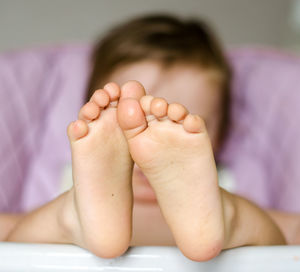 Feet of baby lying in crib