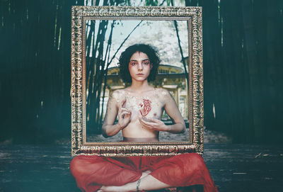 Portrait of woman sitting in temple