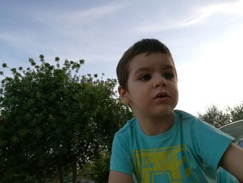 Portrait of boy against sky