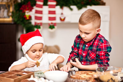 Cute boy and son on table