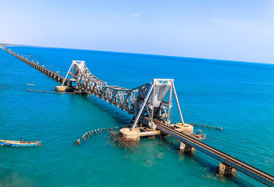 High angle view of bay against blue sky