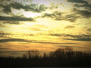 Scenic view of cloudy sky at sunset