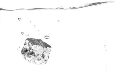Close-up of water over white background