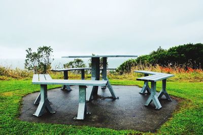 Chairs and tables against clear sky