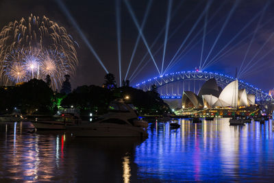 Illuminated ferris wheel at night