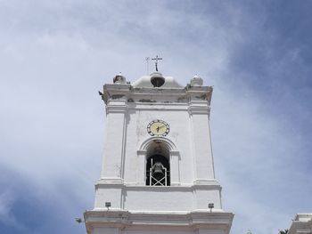 Low angle view of bell tower against sky