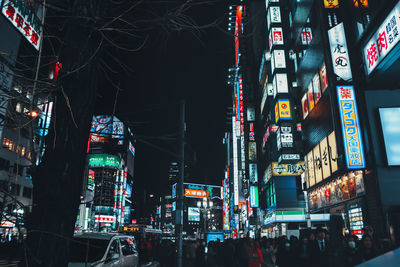 Illuminated city street at night