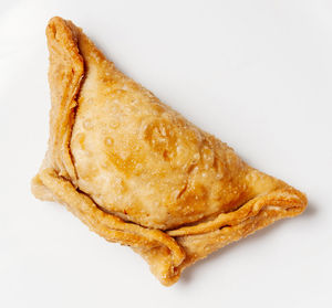 High angle view of bread in plate against white background