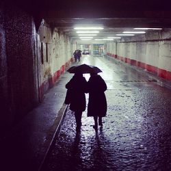 People walking in tunnel