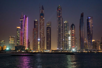 Low angle view of illuminated city at night