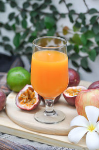 Close-up of orange juice on table