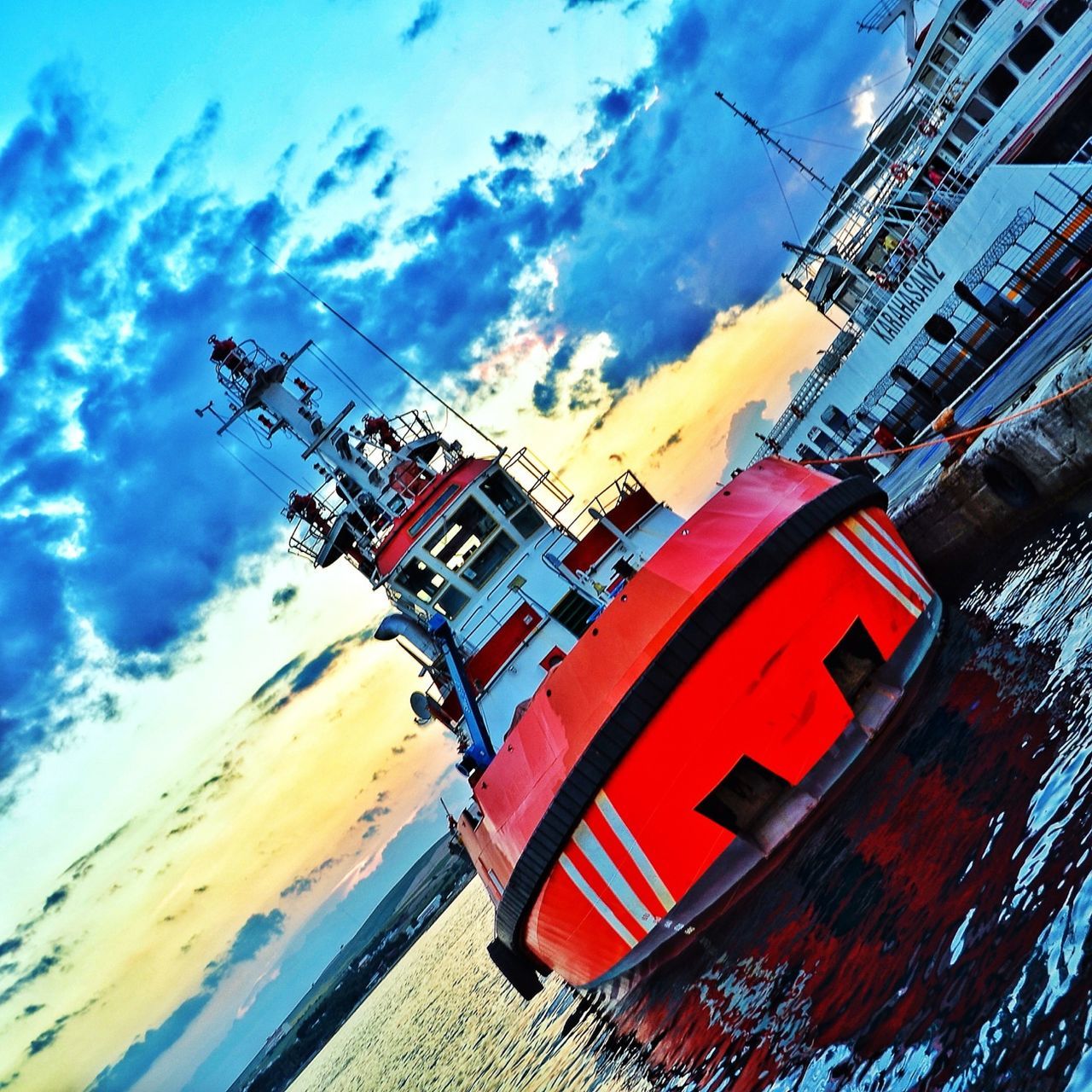 sky, mode of transport, transportation, cloud - sky, low angle view, building exterior, cloudy, built structure, cloud, crane - construction machinery, architecture, outdoors, day, nautical vessel, travel, sunlight, construction site, no people, development, construction