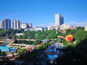 Aerial view of water park against cityscape