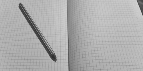 High angle view of pen on book