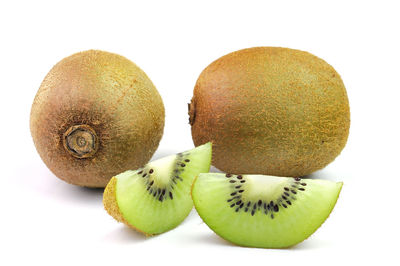 Close-up of fruits against white background